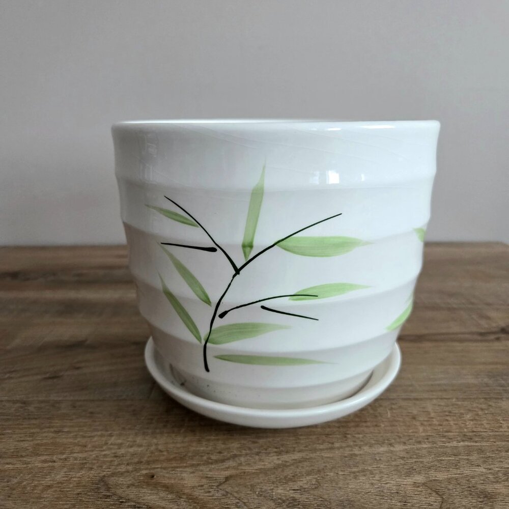 Ceramic 6'' tall planter/cover pot with attached saucer.